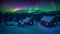 enchanting winter landscape, clear aurora, starry night, warm house lights, polar view, snowy rural aerial scenery