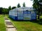 Enclosed ball court of blue pipe light metal frame and white vinyl net