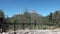 Enclosure and Green mountains on background of clear blue sky in Argentina.