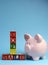 End of Financial Year sale message on building blocks with piggy bank - vertical with copy space.