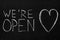 End of quarantine.Chalkboard text message We`re open.After coronavirus outbreak