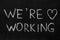 End of quarantine.Chalkboard text message We`re working.