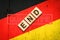 End of quarantine. The inscription on wooden blocks on the background of the flag of Germany. The end of the pandemic. Business