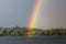 The end of a rainbow during a storm over the Susquehanna River