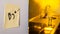 End of relationship concept: a goodbye note on a refrigerator with kitchen appliances and yellow lights in blurred background