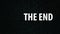 The End title on TV noise background. Ending sequence.