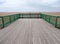 The end of the victorian pier at St Annes on sea in lancashire looking out onto the beach at low tide with the sea in the distance