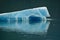 Endicott Arm, Alaska: A brilliant aqua-colored iceberg that has calved off of the Dawes Glacier