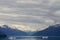 Endicott Arm, Alaska: Snow-capped mountains under a dramatic cloudy sky