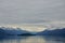 Endicott Arm, Alaska, USA: Snow-capped mountains behind a small island