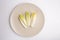 endive on plate top view on white background, salad chicory roots, healthy organic food concept