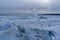 Endless blue ice hummocks in winter on the frozen Lake Baikal