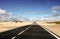 Endless coastal road and sand