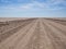 Endless empty dirt road in Namib desert of Namib-Naukluft National Park, Namibia, Africa