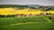 Endless Green Fields, Rolling Hills, Tractor Tracks, Spring Landscape under Blue Sky. South Moravia, Czech Republic