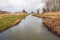 Almost endless long stream with a windmill in the background