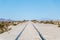 Endless rail road at Steam locomotives cemetery, Uyuni Salt flat, Bolivia