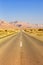 Endless road driving drive empty desert landscape portrait format loneliness infinite