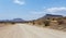 Endless road in Namibia moonscape landscape