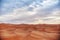 Endless Sands of the Sahara desert, the hot scorching sun shines on the sand dunes. Morocco Merzouga