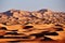 Endless Sands of the Sahara desert, the hot scorching sun shines on the sand dunes. Morocco Merzouga