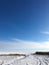 Endless winter landscape on a sunny day with blue sky