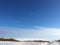 Endless winter landscape on a sunny day with blue sky