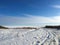 Endless winter landscape on a sunny day with blue sky