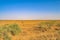 Endless Yellow Soil Land and Blue Sky