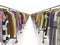 An endlessly long range of clothing racks with a big choice of products. Second hand stock or sale of clothing. Shopping and