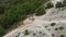 Enduro bikes climbing a mountain of fine white sand