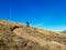 Enduro ride with steep bend, banked curve, Swiss Mountain Alps at Davos Switzerland. With blue clear sky and great view