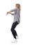 Energetic ecstatic blonde woman dancing. Side view.