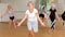 Energetic elderly woman practicing vigorous dance movements