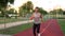 energetic man running on run track in the park, sport