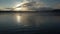 Energetic man swims crawl in a nice lake at sunset in slo-mo