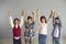 Energetic optimistic preteen children show hand up with thumbs up gesture