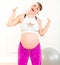 Energetic pregnant woman enjoying making sports