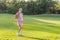 Energetic pregnant woman takes her workout outdoors, using an exercise mat for a refreshing and health-conscious outdoor