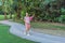 Energetic pregnant woman takes her workout outdoors, using an exercise mat for a refreshing and health-conscious outdoor