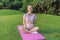 Energetic pregnant woman takes her workout outdoors, using an exercise mat for a refreshing and health-conscious outdoor