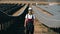 Energetics engineer is standing between rows of solar panels