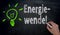 Energiewende in german green Energy is written by hand on blac