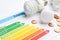 Energy efficiency rating chart, coins and light bulbs