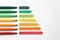 Energy efficiency rating chart and colorful markers on white background, space for text
