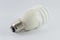 Energy saving fluorescent light bulb on white bakground