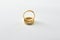 Engagement gold ring standing on each other isolated white