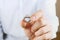 Engagement / marriage / wedding proposal scene. Close up of man handing the expensive gold platinum diamond ring to his bride.