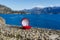 Engagement ring in a red velvet box for a marriage proposal while traveling around Europe and the world - in Italy on Lake Como