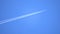 Engine exhaust contrails forming behind flying commercial airplane